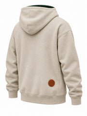 Rear three-quarter view of the Mountain Patch oatmeal felt appliqué hoodie