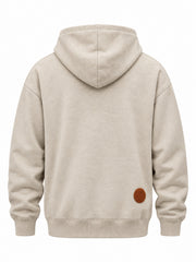 Back view of the Mountain Patch oatmeal felt appliqué hoodie with small circular felt sun patch on the lower right