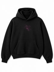 Front view of the Flock Panther black flock print oversized hoodie with a small tonal plum panther-eye motif