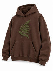 Front three-quarter view of the Velvet Fern chocolate brown flock print boxy hoodie