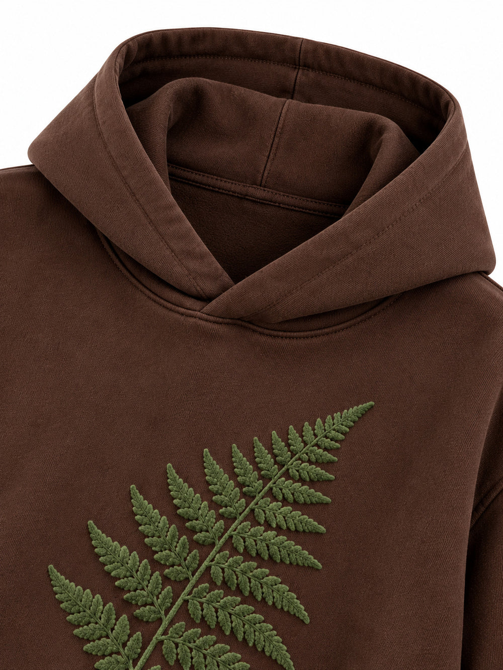 Close-up of the hood and neckline of the Velvet Fern chocolate brown flock print boxy hoodie