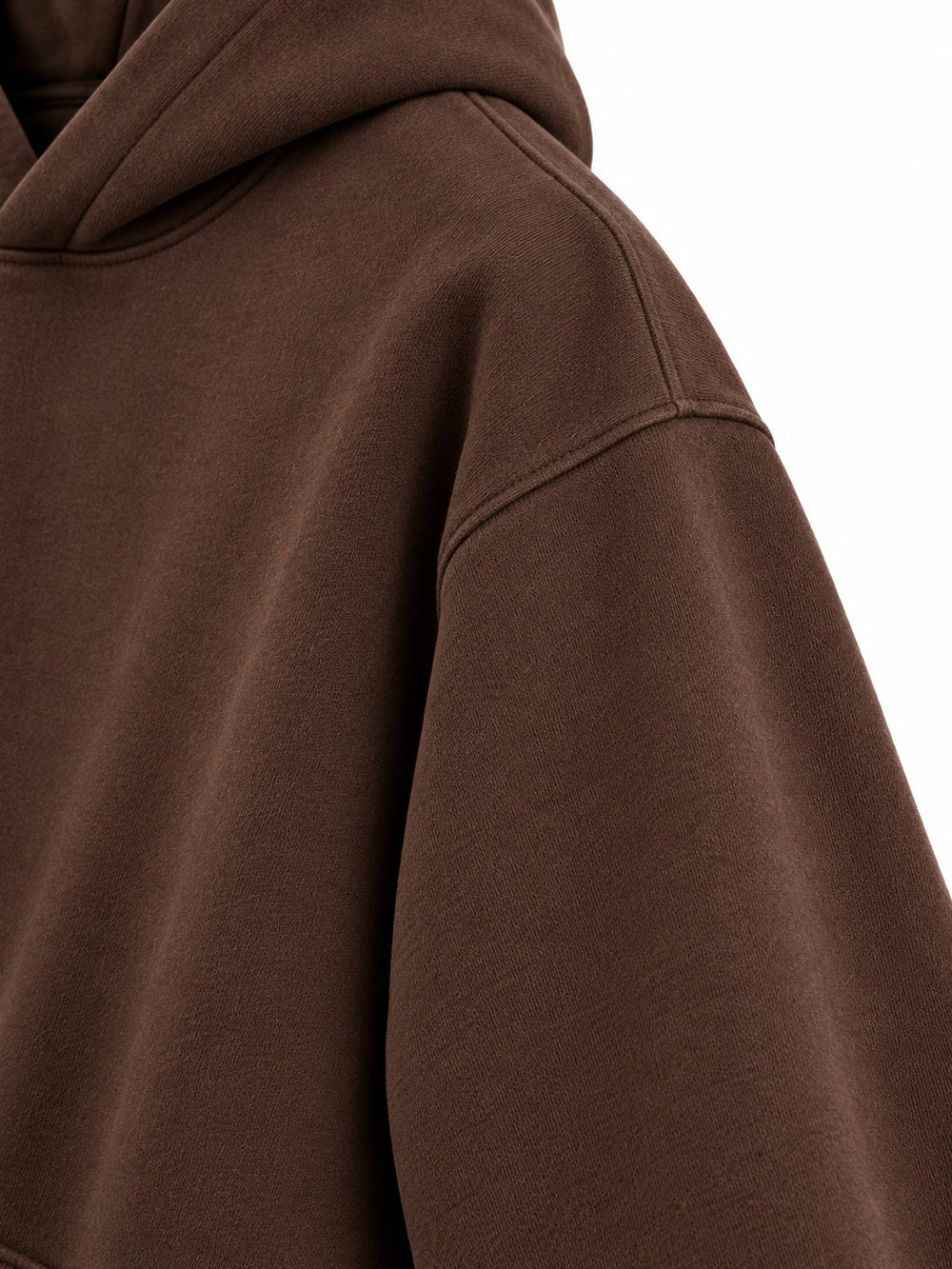 Close-up of the sleeve of the Velvet Fern chocolate brown flock print boxy hoodie