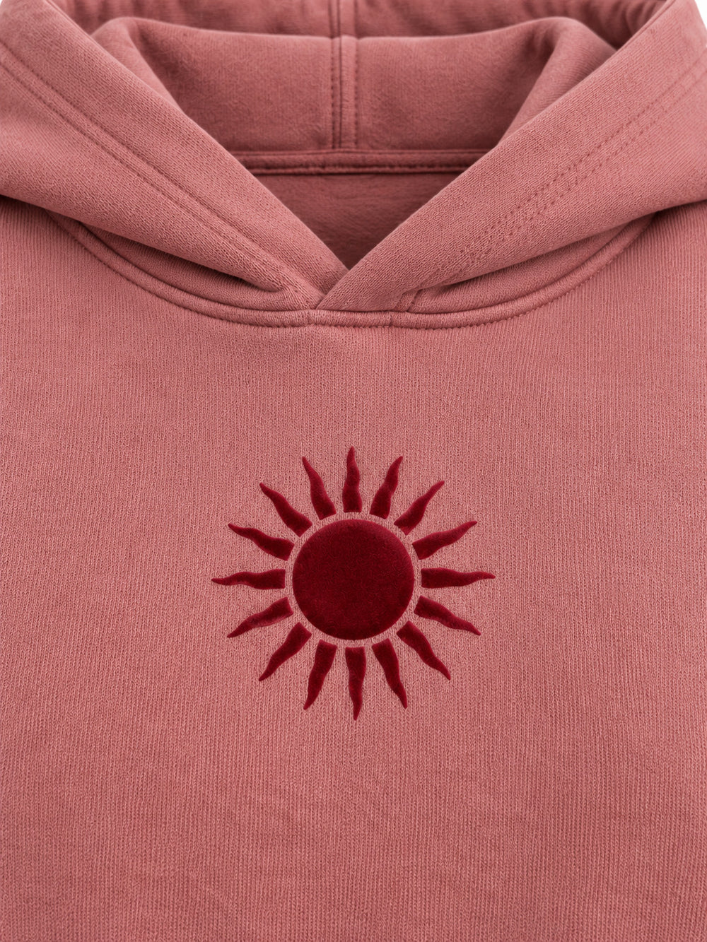 Close-up of the flock print decoration on the Velvet Sun dusty rose flock print cropped hoodie