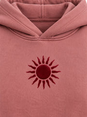 Close-up of the flock print decoration on the Velvet Sun dusty rose flock print cropped hoodie