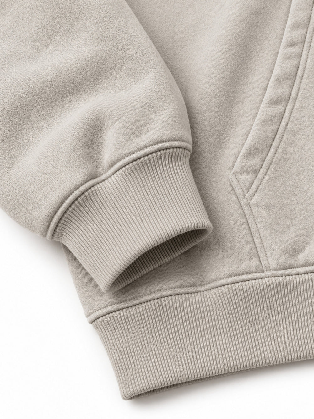 Close-up of the cuff and hem rib of the Velvet Wave light stone flock print hoodie
