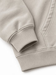 Close-up of the cuff and hem rib of the Velvet Wave light stone flock print hoodie