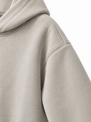 Close-up of the sleeve of the Velvet Wave light stone flock print hoodie