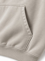 Close-up of the seam stitching of the Velvet Wave light stone flock print hoodie