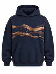 Front view of the Copper Horizon midnight navy foil print oversized hoodie with flowing copper foil wave lines across the chest