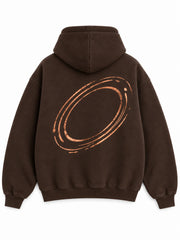 Back view of the Copper Orbit espresso brown foil print oversized hoodie with a large copper-tone elliptical orbit