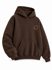 Front three-quarter view of the Copper Orbit espresso brown foil print oversized hoodie