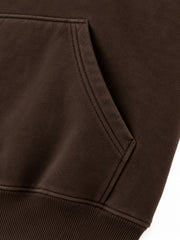 Close-up of the seam stitching of the Copper Orbit espresso brown foil print oversized hoodie