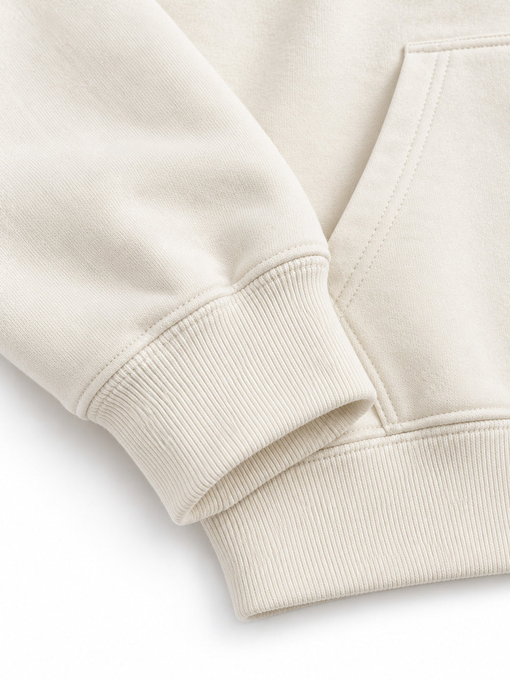 Close-up of the cuff and hem rib of the Gold Ginkgo cream foil print hoodie