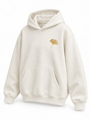 Front three-quarter view of the Gold Ginkgo cream foil print hoodie