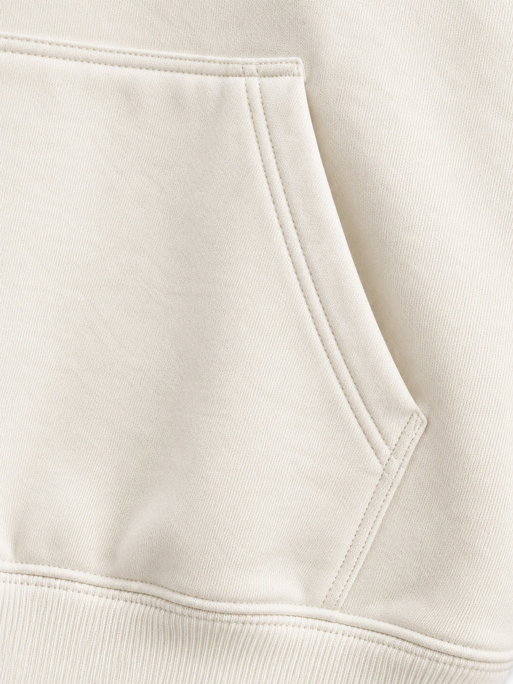 Close-up of the seam stitching of the Gold Ginkgo cream foil print hoodie
