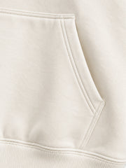 Close-up of the seam stitching of the Gold Ginkgo cream foil print hoodie