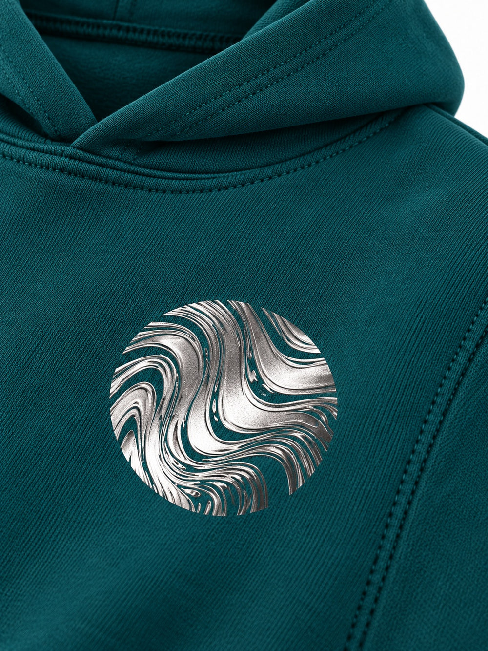 Close-up of the foil print decoration on the Liquid Moon petrol teal foil print cropped hoodie