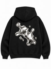 Back view of the Liquid Silver black foil print zip-up hoodie with a large silver-tone abstract liquid splash