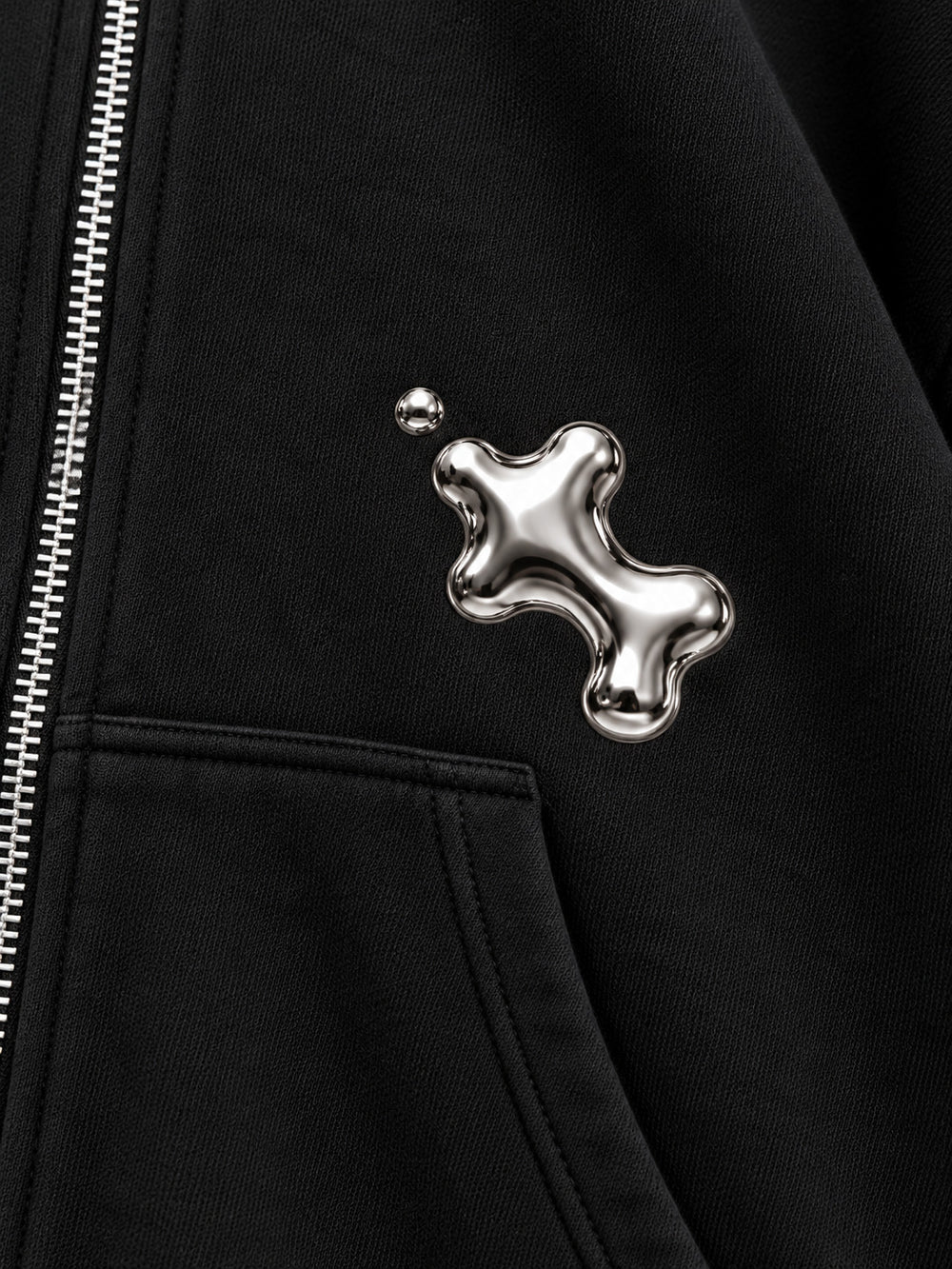 Close-up of the foil print decoration on the Liquid Silver black foil print zip-up hoodie