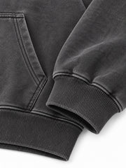 Close-up of the cuff and hem rib of the Prism Chrome charcoal foil print oversized hoodie