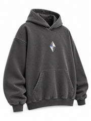 Front three-quarter view of the Prism Chrome charcoal foil print oversized hoodie