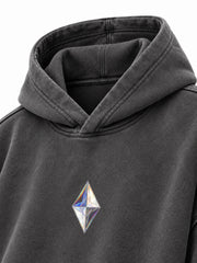 Close-up of the hood and neckline of the Prism Chrome charcoal foil print oversized hoodie