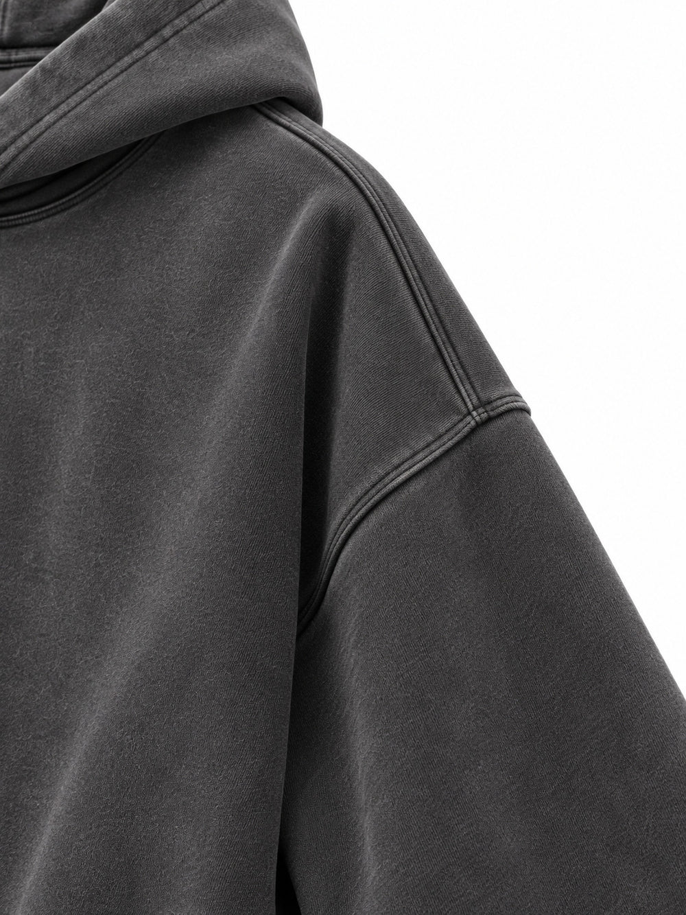 Close-up of the sleeve of the Prism Chrome charcoal foil print oversized hoodie