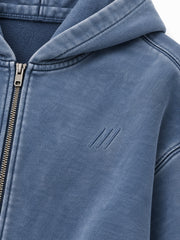 Close-up of the mineral wash decoration on the Quiet Motion slate blue mineral wash oversized zip-up hoodie