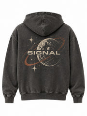Back view of the Stone Signal charcoal mineral wash oversized hoodie with large faded cream and rust orbit-and-star print with SIGNAL