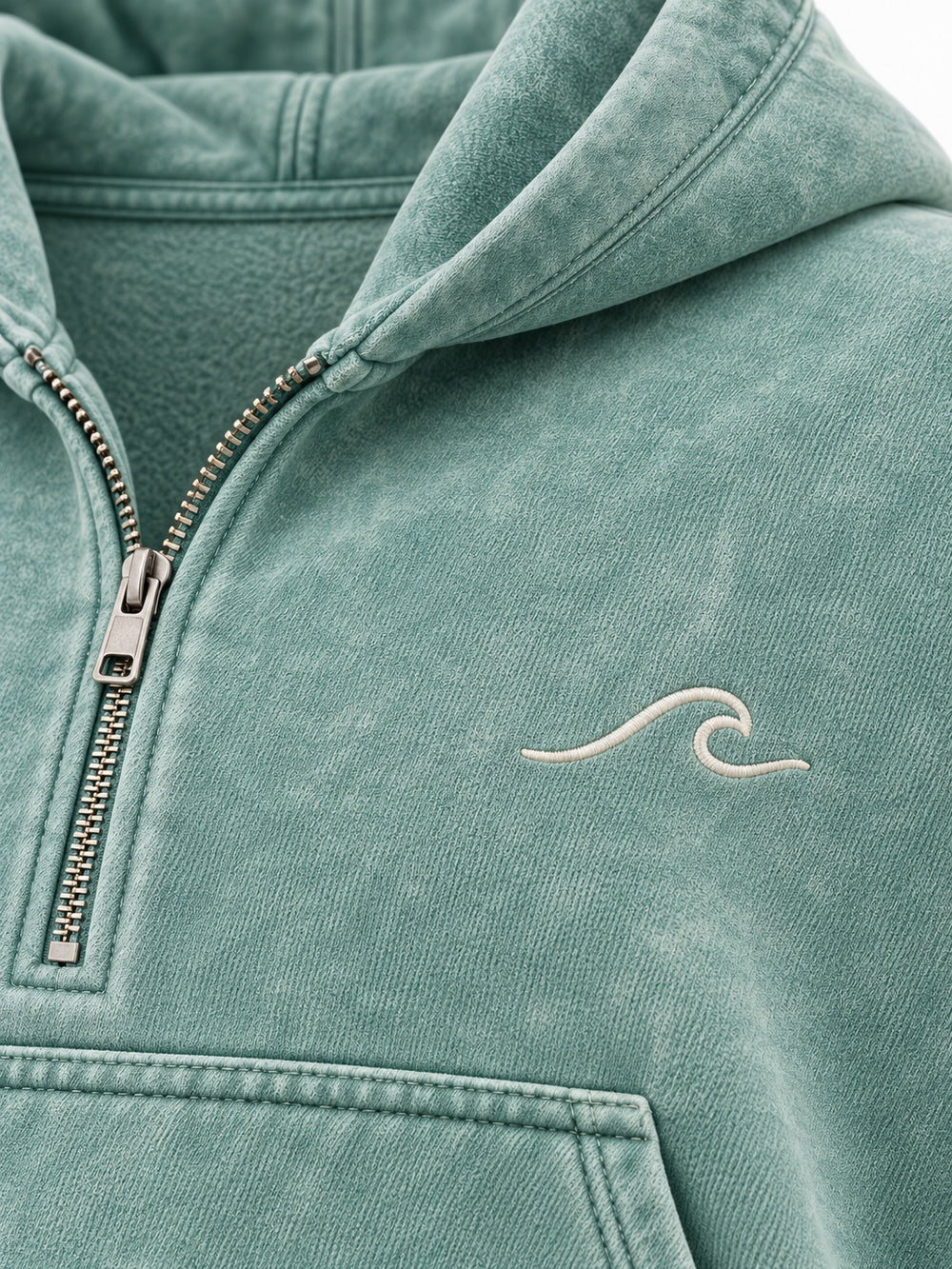 Close-up of the mineral wash decoration on the Tide Mark seafoam mineral wash cropped half-zip hoodie