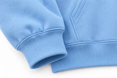 Close-up of the seam stitching of the Cloud Nine sky blue puff print oversized hoodie