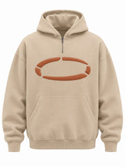 Front view of the Dune Pulse sand puff print oversized quarter-zip hoodie with rust puff-print ring made of broken segments across the chest