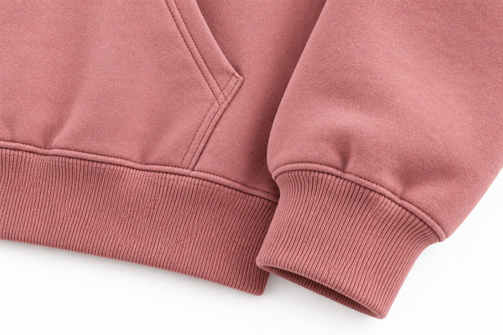 Close-up of the seam stitching of the Good Space dusty rose puff print hoodie