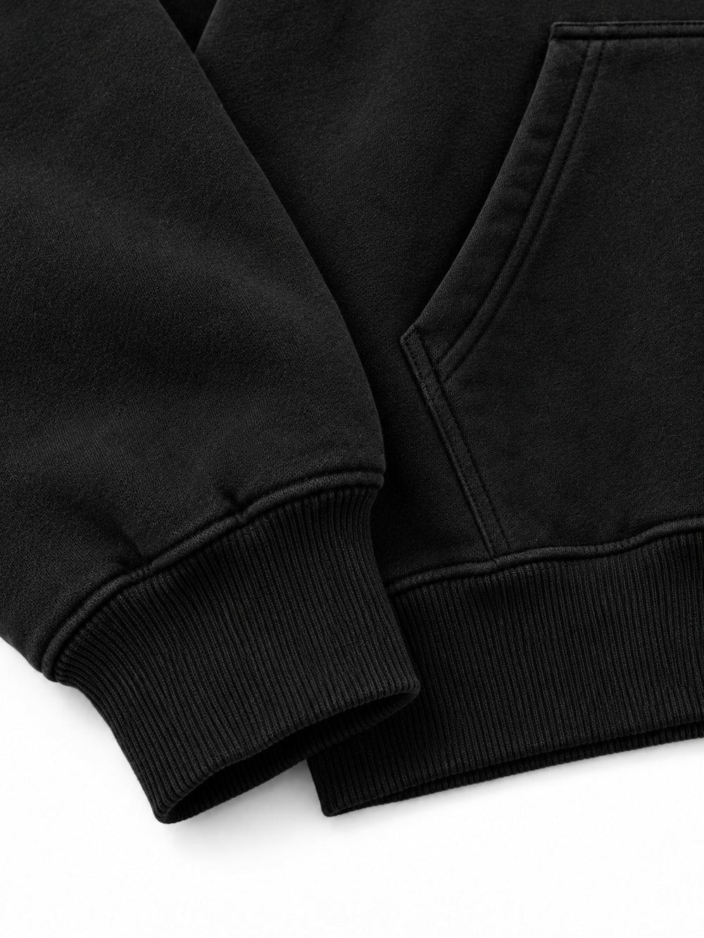 Close-up of the cuff and hem rib of the Lava Lines black puff print boxy hoodie