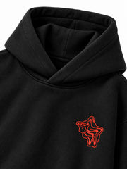 Close-up of the hood and neckline of the Lava Lines black puff print boxy hoodie