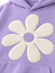 Close-up of the puff print decoration on the Lilac Bloom lilac puff print oversized hoodie