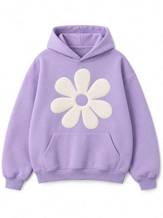 Front view of the Lilac Bloom lilac puff print oversized hoodie with a large ivory puff-print daisy on the chest