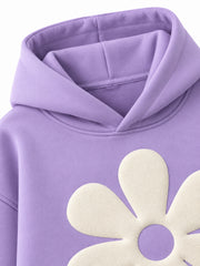 Close-up of the hood and neckline of the Lilac Bloom lilac puff print oversized hoodie
