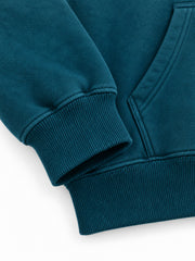 Close-up of the cuff and hem rib of the Ocean Pulse deep teal puff print hoodie