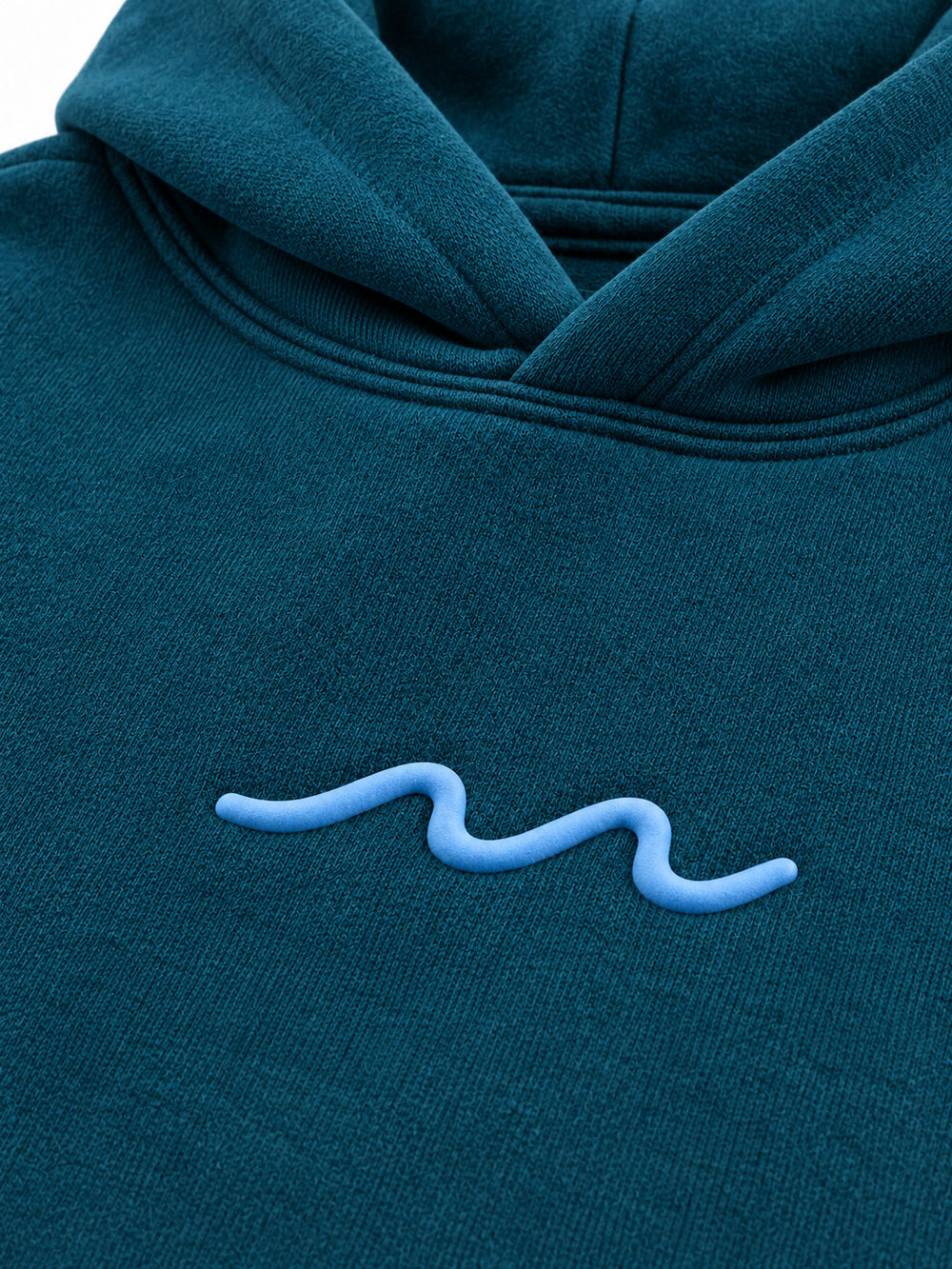Close-up of the puff print decoration on the Ocean Pulse deep teal puff print hoodie