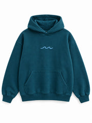Front view of the Ocean Pulse deep teal puff print hoodie with a small pale-blue wave at the center chest