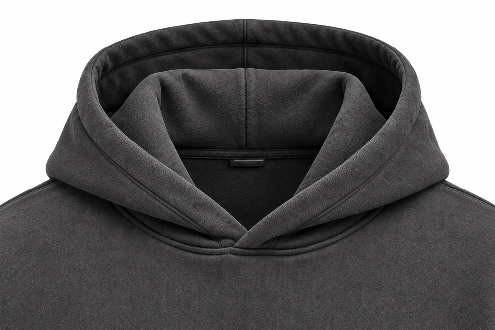 Close-up of the hood and neckline of the Off Grid charcoal puff print boxy hoodie