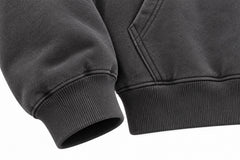 Close-up of the seam stitching of the Off Grid charcoal puff print boxy hoodie