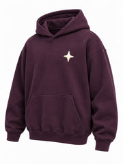 Front three-quarter view of the Orbit dark plum puff print oversized hoodie