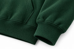 Close-up of the seam stitching of the Outside pine green puff print hoodie