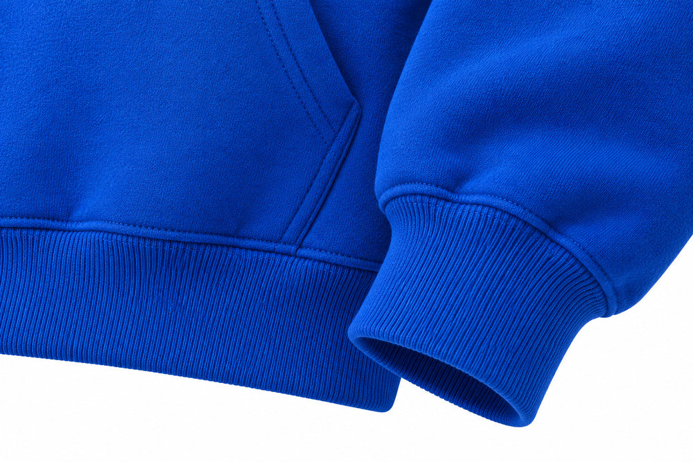 Close-up of the seam stitching of the Rise cobalt blue puff print boxy hoodie