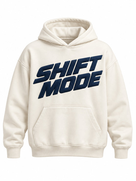 Front view of the Shift Mode ivory puff print oversized hoodie with large slanted navy SHIFT MODE lettering in puff print