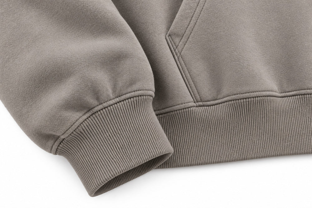 Close-up of the seam stitching of the Slow Motion warm gray puff print oversized hoodie