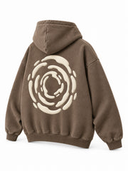 Rear three-quarter view of the Soft Orbit washed mocha puff print oversized hoodie