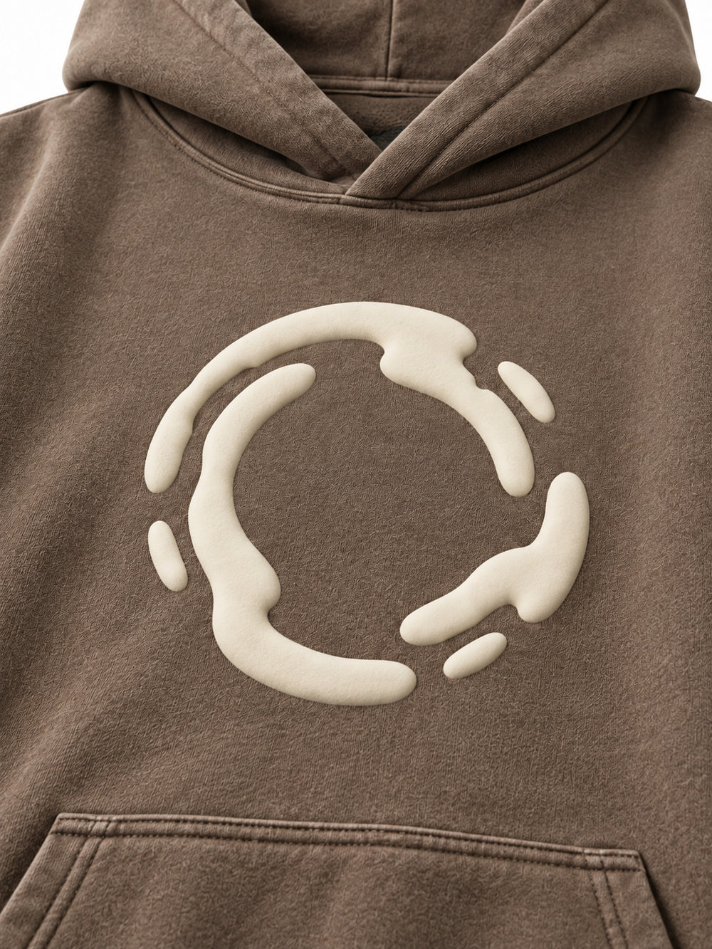 Close-up of the puff print decoration on the Soft Orbit washed mocha puff print oversized hoodie